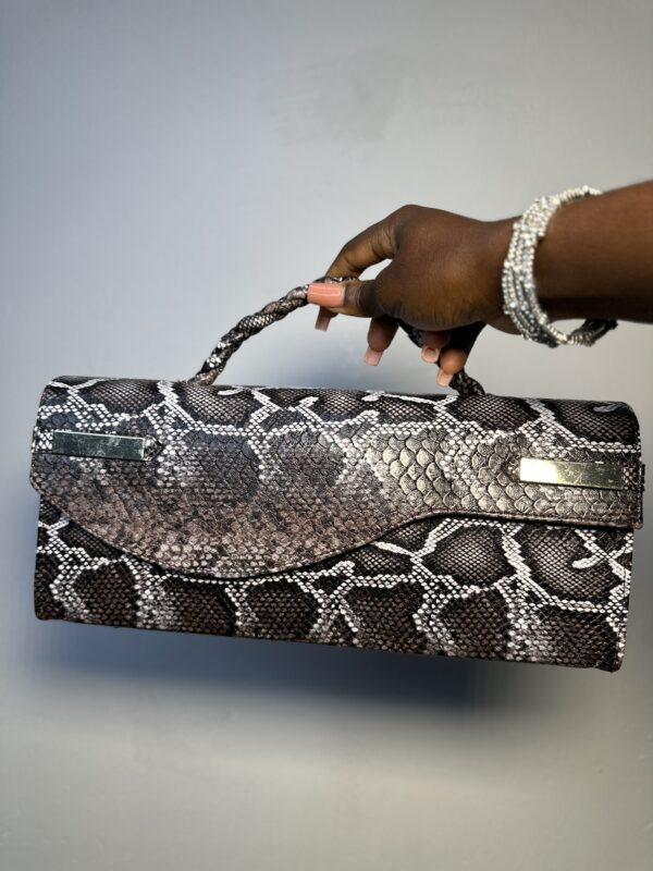 Handmade leather curved flap bag in chocolate snake skin