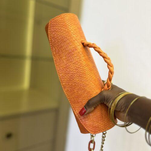 Orange Cylinder leather bag- The braids Brand