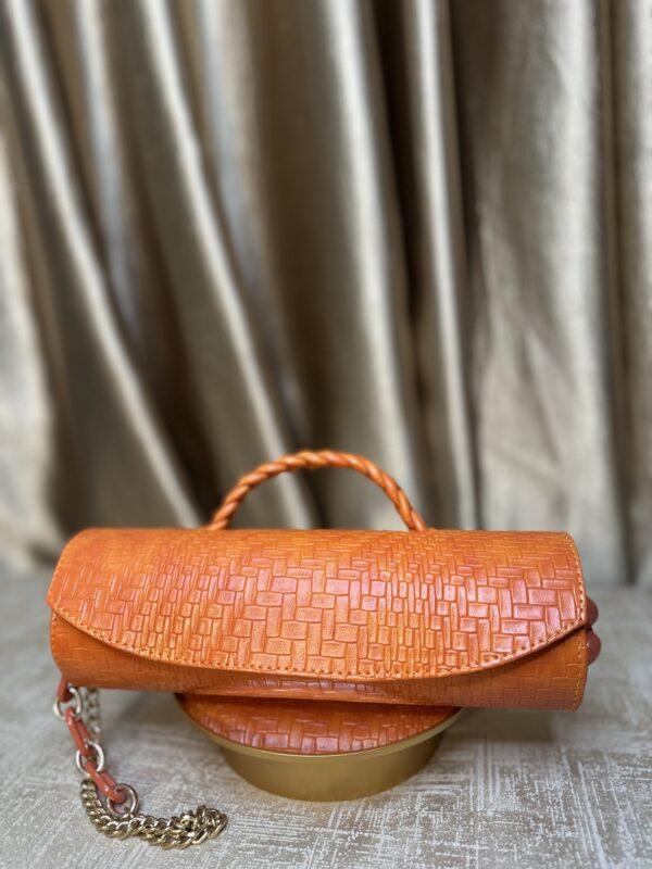 Orange Cylinder leather bag- The braids Brand