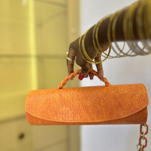 Orange Cylinder leather bag- The braids Brand