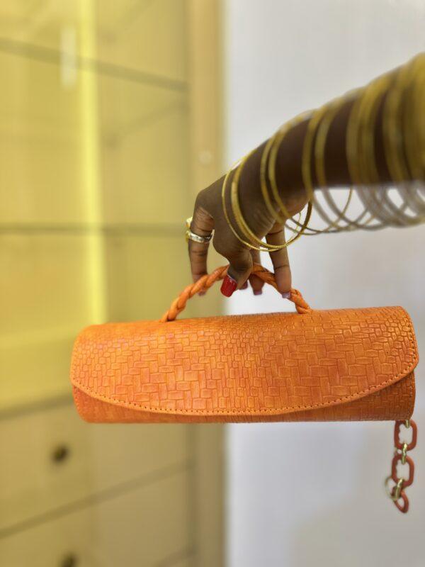 Orange Cylinder leather bag- The braids Brand