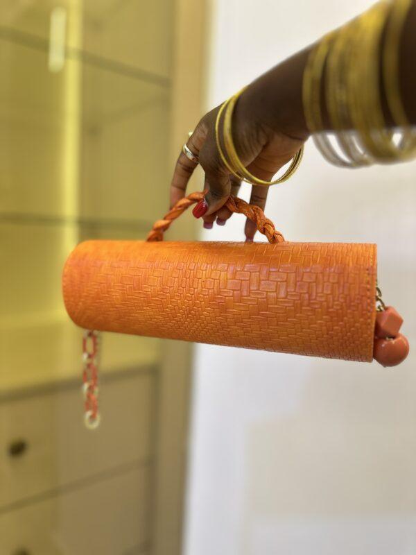 Orange Cylinder leather bag- The braids Brand
