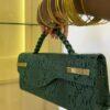 Curved flap leather bag in Green - The braids Brand