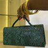 Curved flap leather bag in Green - The braids Brand