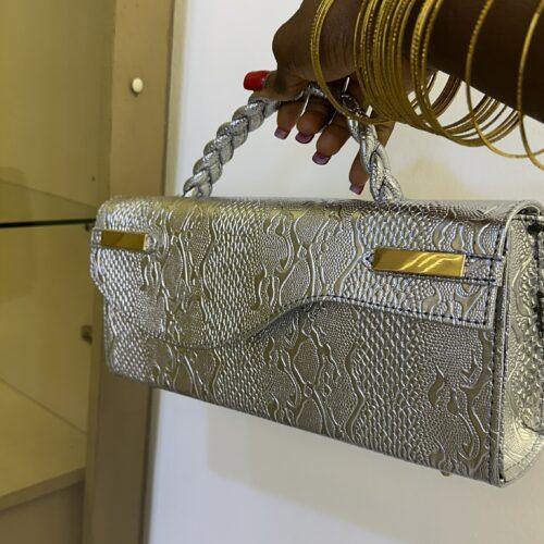 Curved flap leather bag in silver - The braids Brand