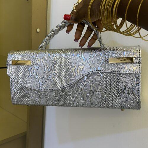 The Delali Bag (3) Curved flap leather bag in silver - The braids Brand