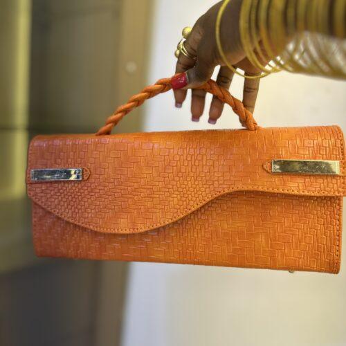 Curved Flap leather bag in orange - The braids Brand