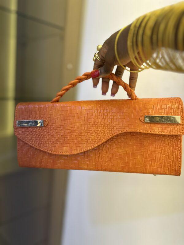Curved Flap leather bag in orange - The braids Brand