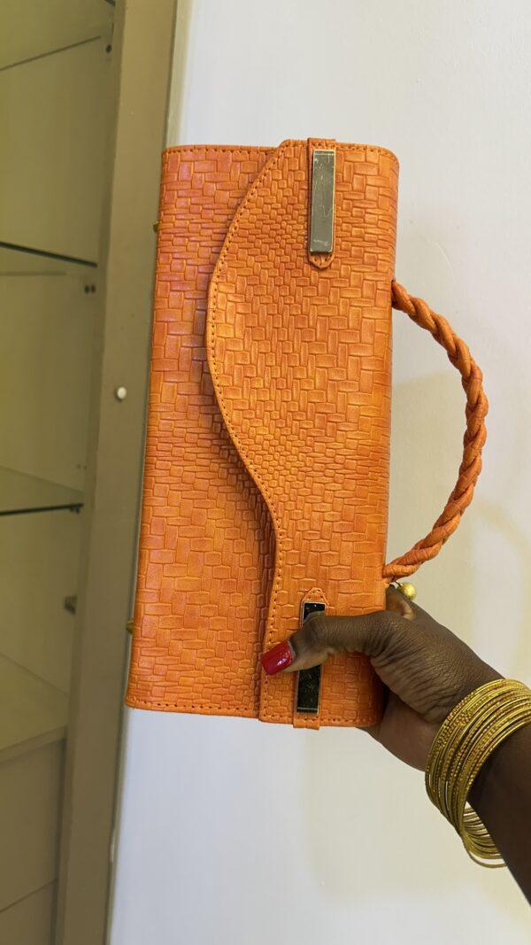 Curved Flap leather bag in orange - The braids Brand