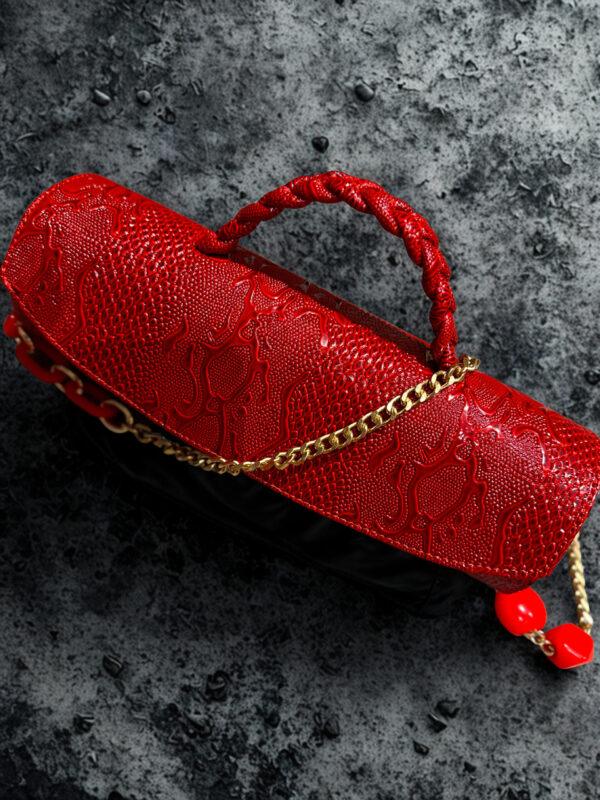 Red cylindrical leather bag